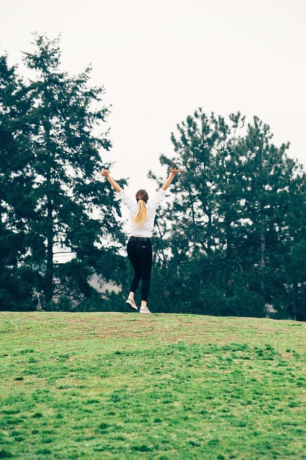 A young woman, running up the hill, romantic or freedom concept stock photos A young woman, running up the hill, romantic or freedom concept stock photos