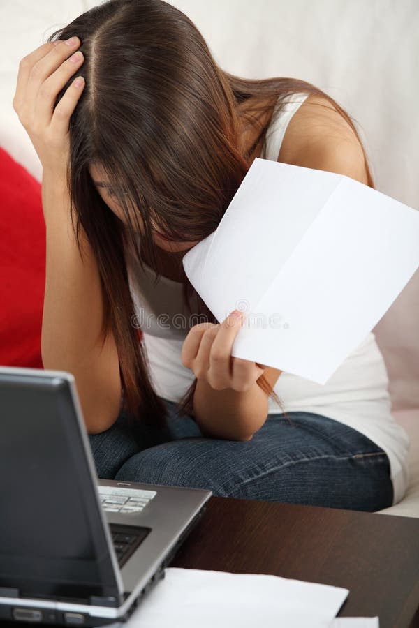 Young woman's paying bills. stock photos