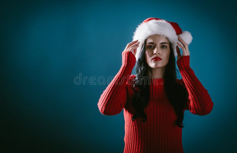 Young woman with a Santa hat stock images Young woman with a Santa hat stock images