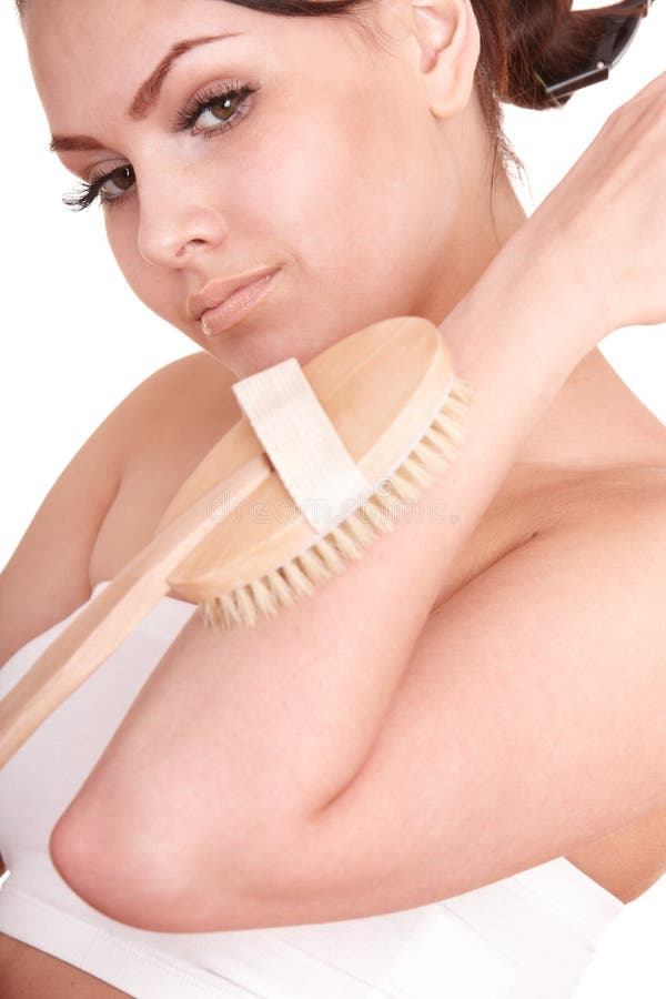 Young woman scrubbing body. royalty free stock photos