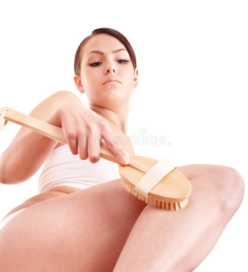 Young woman scrubbing body. stock photos