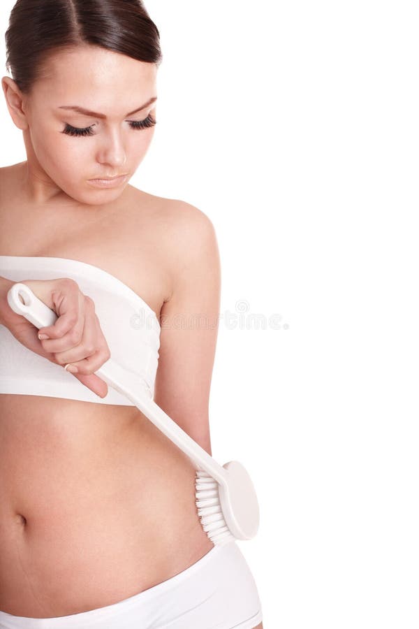 Young woman scrubbing body. royalty free stock photography