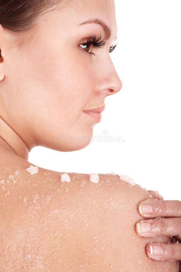 Young woman scrubbing body. royalty free stock images