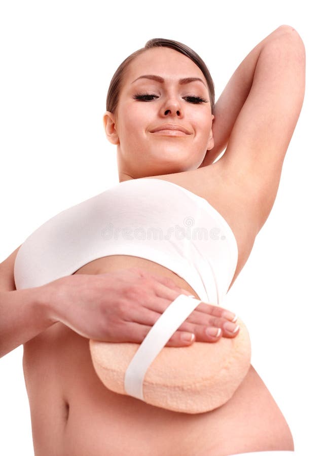 Young woman scrubbing body. royalty free stock photo
