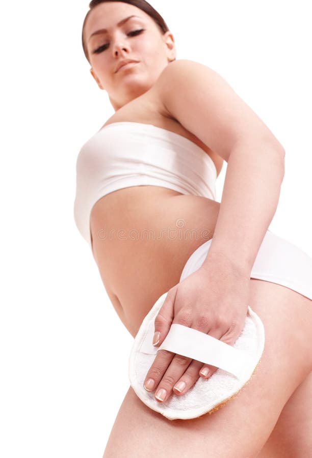 Young woman scrubbing body. royalty free stock photo