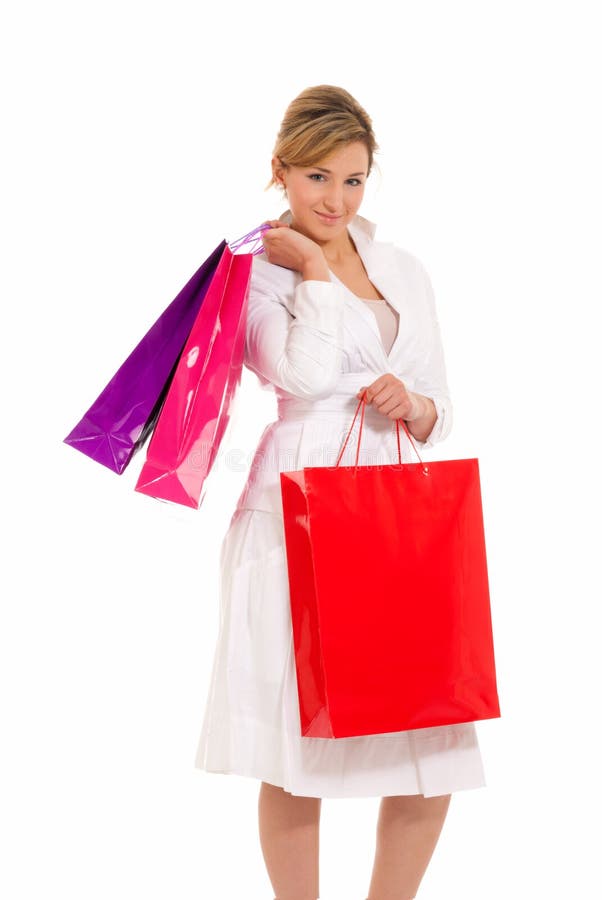 Young woman with shopping bags standing