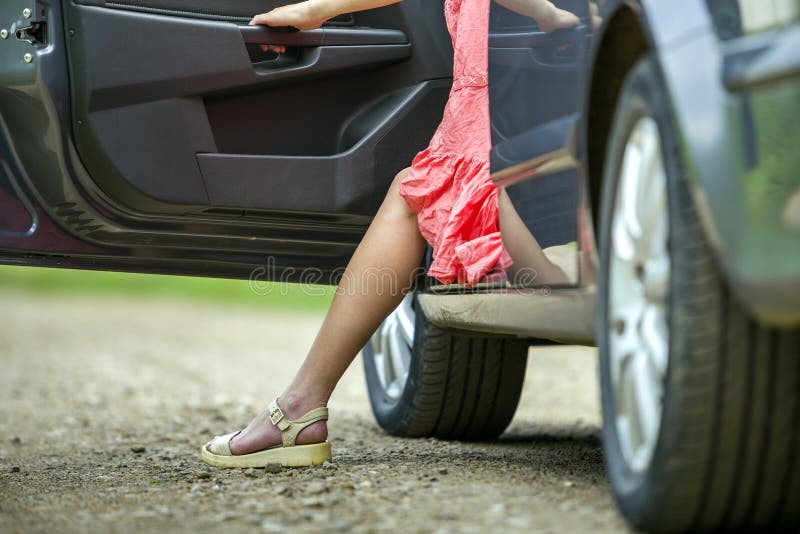Young Woman in Short Dress Getting Out Car with Open Door on Sunny Blurred  Rural Road Background Stock Image - Image of elegant, driver: 150465253