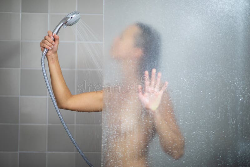 Young woman in shower. 