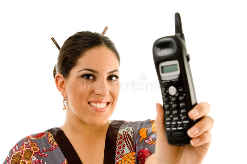 Young woman showing cordless phone