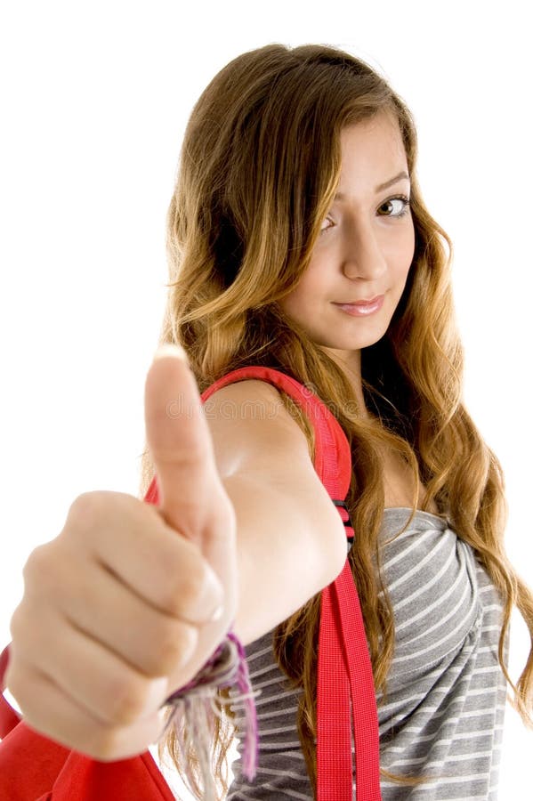 Young woman showing goodluck sign