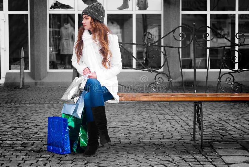 Young woman sitting on a bench