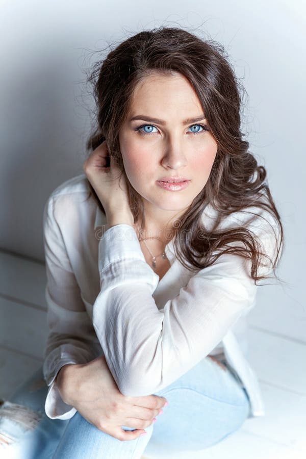 Young Woman Sitting On The Floor Stock Photo - Image of european, body