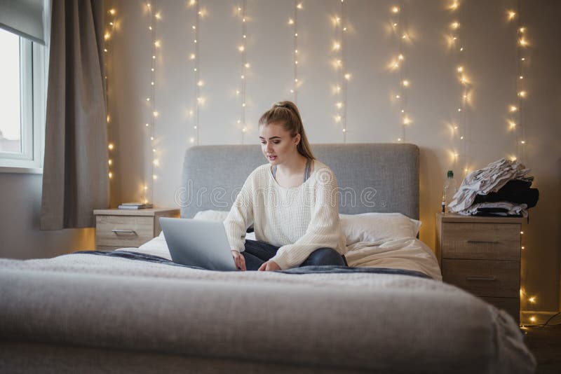 Student Using Laptop in Bedroom Stock Photo Image of double, adult