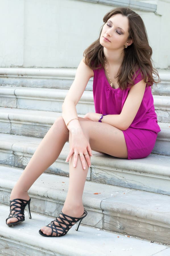 Young Woman Sitting on the Ladder of Old City Stock Image - Image of ...