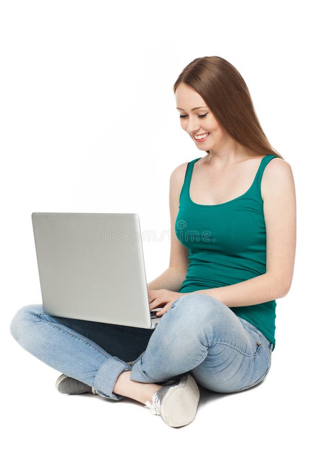 Young woman sitting with laptop stock photography