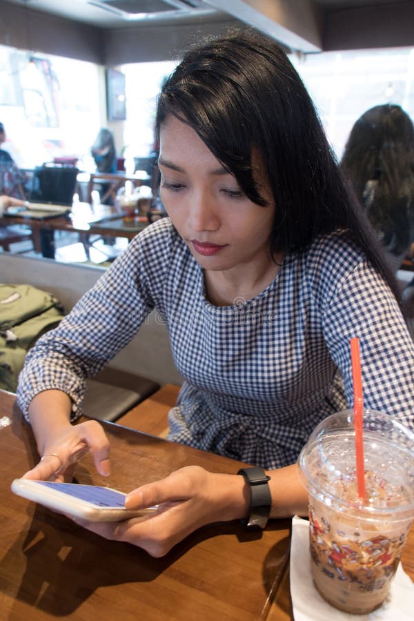 A young woman sitting in a restaurant royalty free stock photo A young woman sitting in a restaurant royalty free stock photo