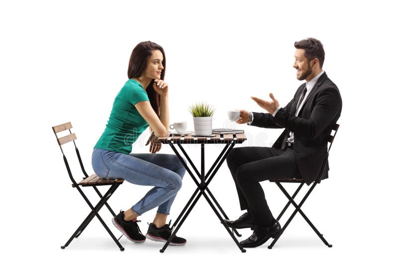 Young Woman Sitting at a Wooden Table and Talking with a Businessman ...