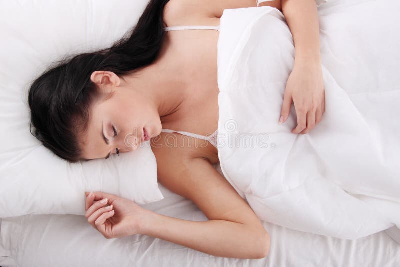 Young woman sleeping on the bed