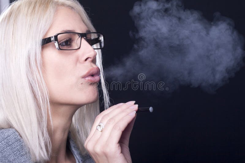 Young woman Smokin Electic Cigarette royalty free stock photos Young woman Smokin Electic Cigarette royalty free stock photos