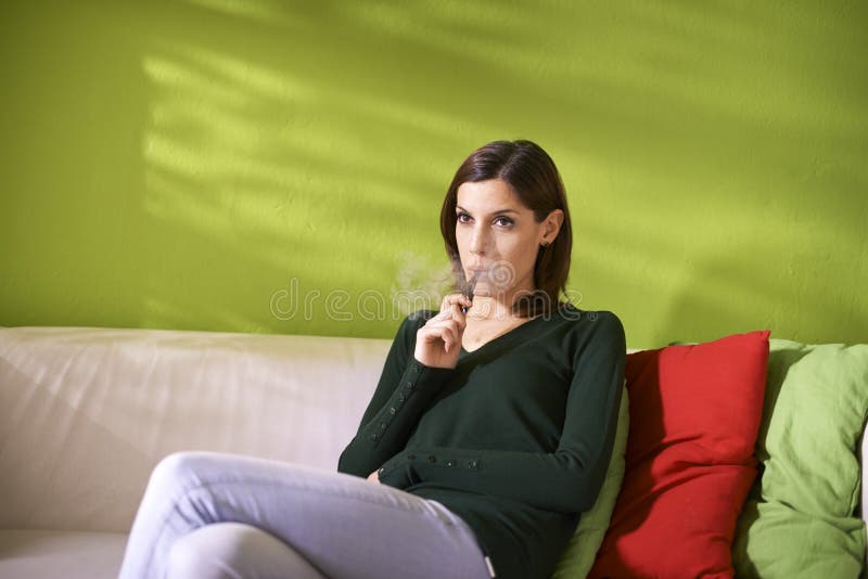Young Woman Smoking Electronic Cigarette Stock Image 