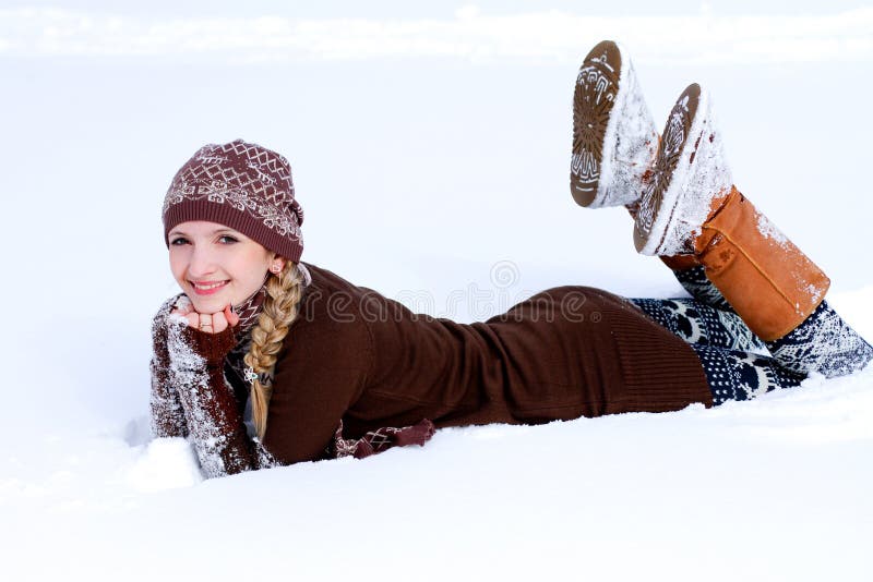 Young woman on the snow outdoors