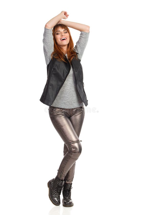 Young Woman is Standing with Arms Raised and Laughing Stock Photo ...