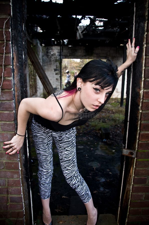 Young Woman Standing in Doorway