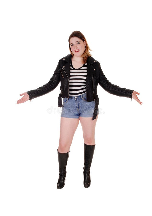 Young woman standing in the studio arms outstretched