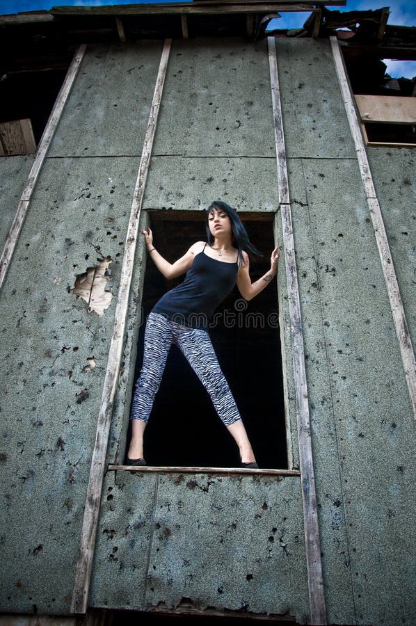 Young Woman Standing in Window