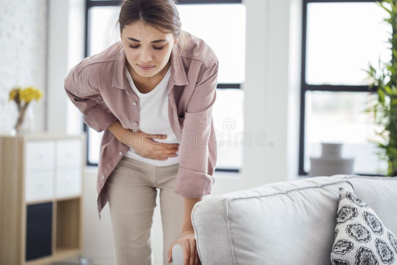 Young woman with stomach pain