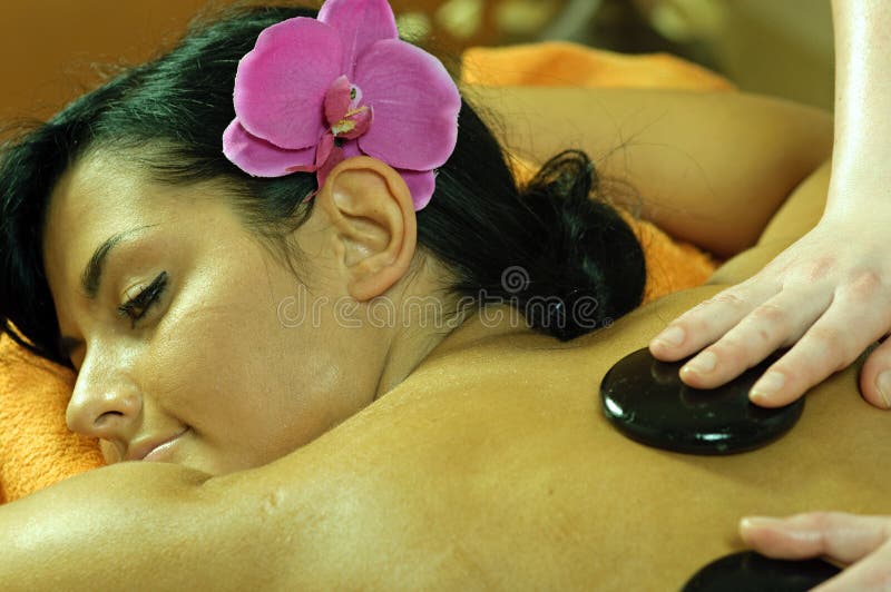 Young Woman and Stone Massage