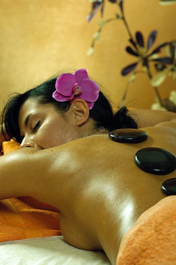 Young Woman and Stone Massage