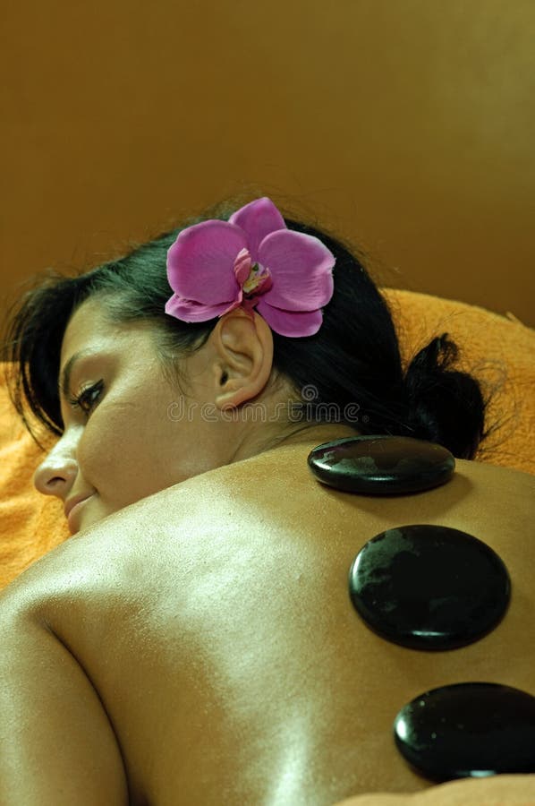 Young Woman and Stone Massage