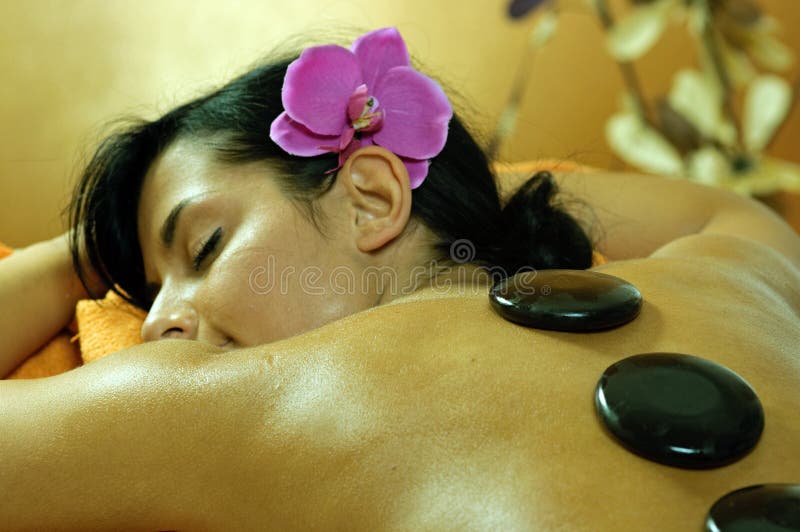 Young Woman and Stone Massage