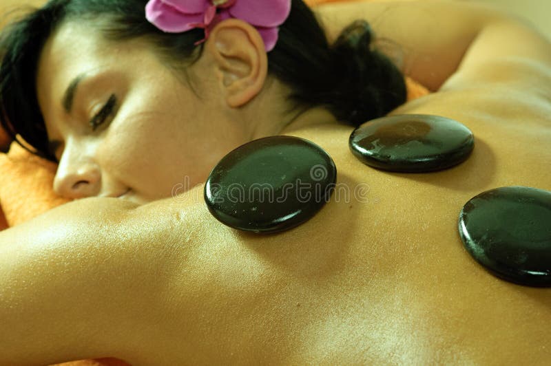 Young Woman and Stone Massage