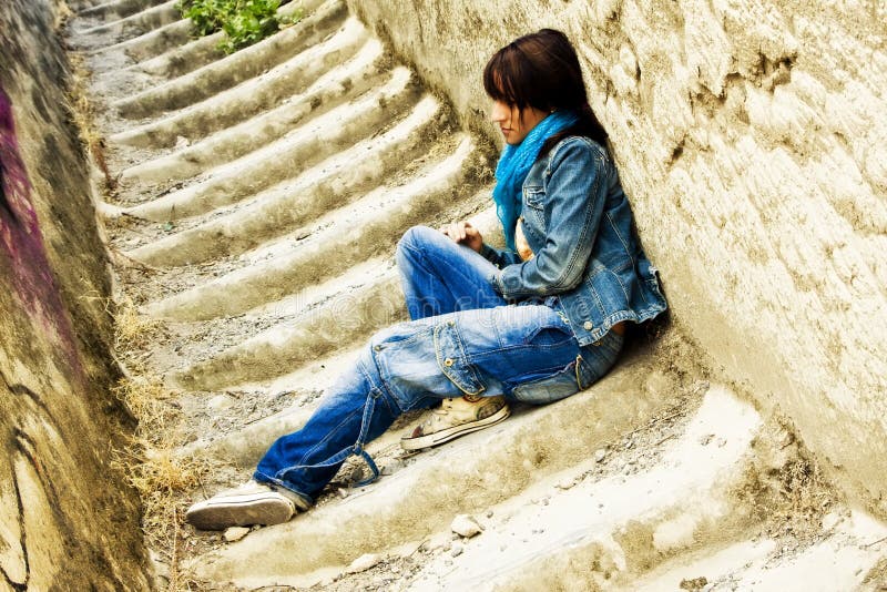 Young woman on stone stairs