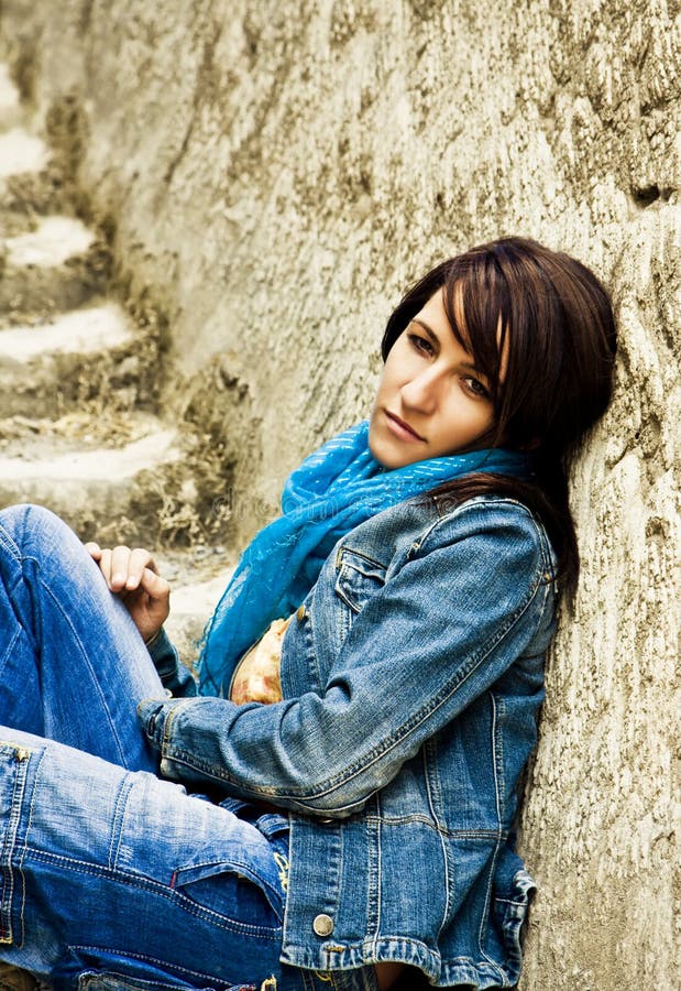 Young woman on stone stairs