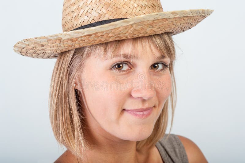 Young woman in a straw hat stock photo. Image of nice 33079706