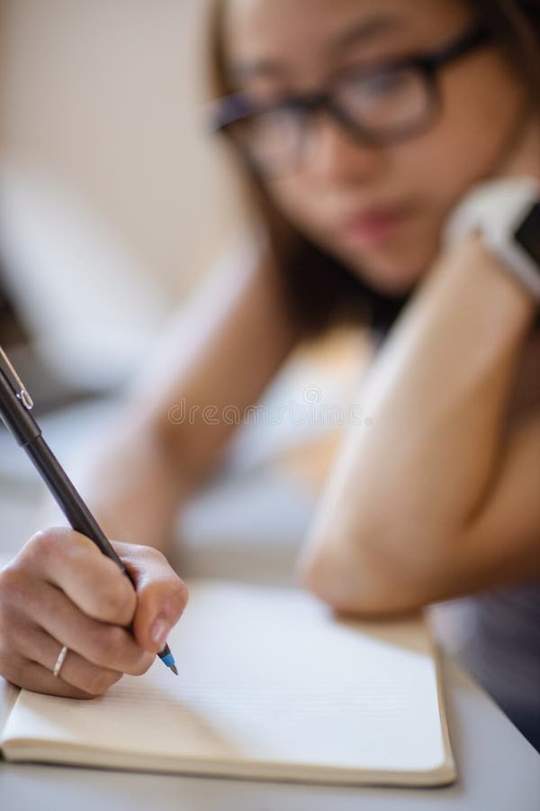 Young woman studying in classroom royalty free stock photo