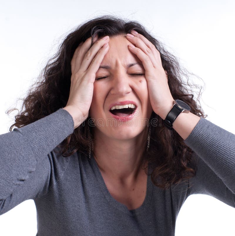 Young woman suffering from a terrible headach