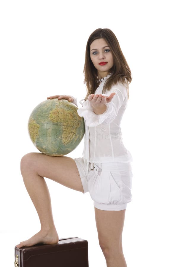 Young woman with suitcase and globe