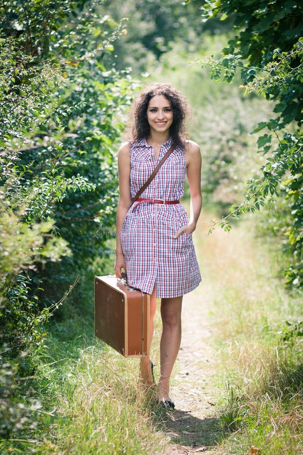 Young Woman with a Suitcase Stock Photo Image of moving, danger 48410654