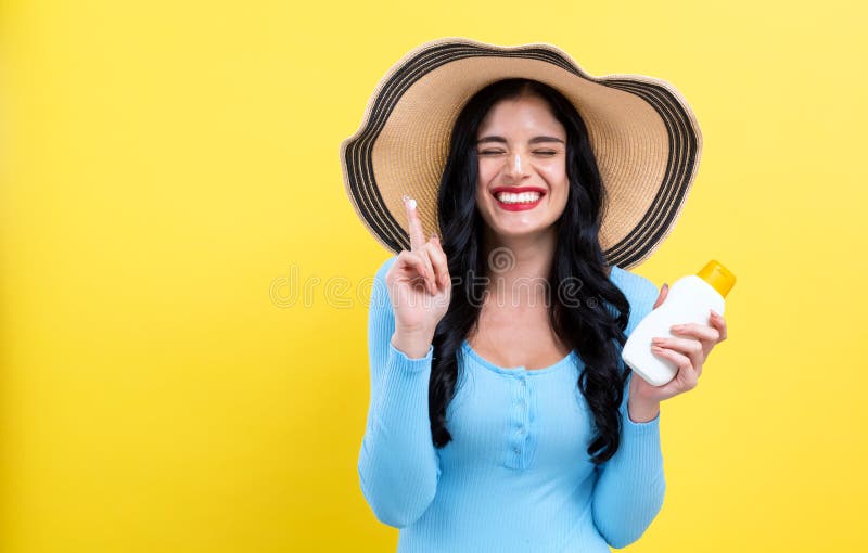 Young woman with sunscreen stock image Young woman with sunscreen stock image