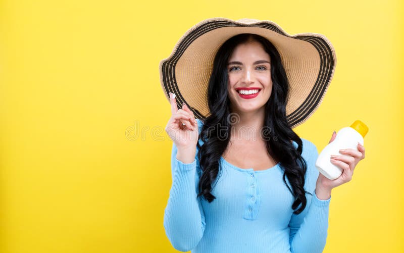 Young woman with sunscreen stock image Young woman with sunscreen stock image