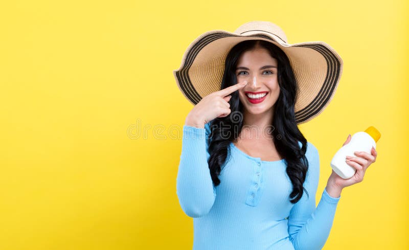 Young woman with sunscreen stock images Young woman with sunscreen stock images