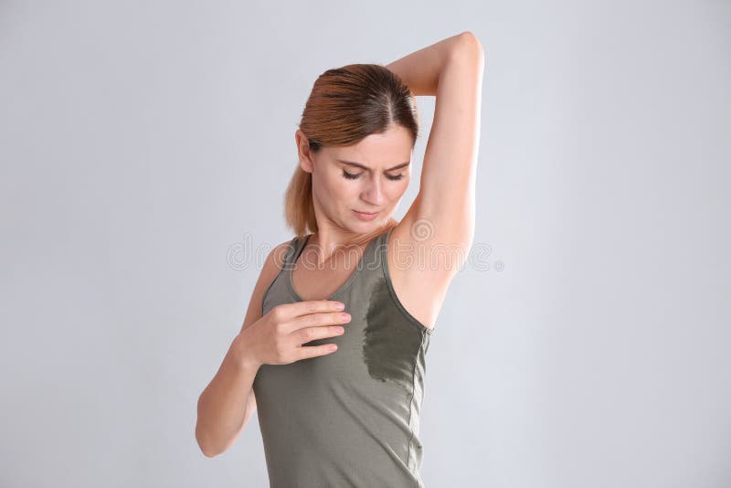 Young Woman With Sweat Stain On Her Clothes Stock Photo Image Of