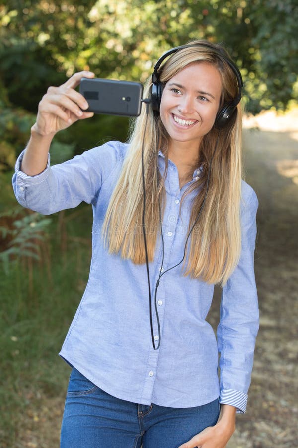Young woman taking selfie stock photos
