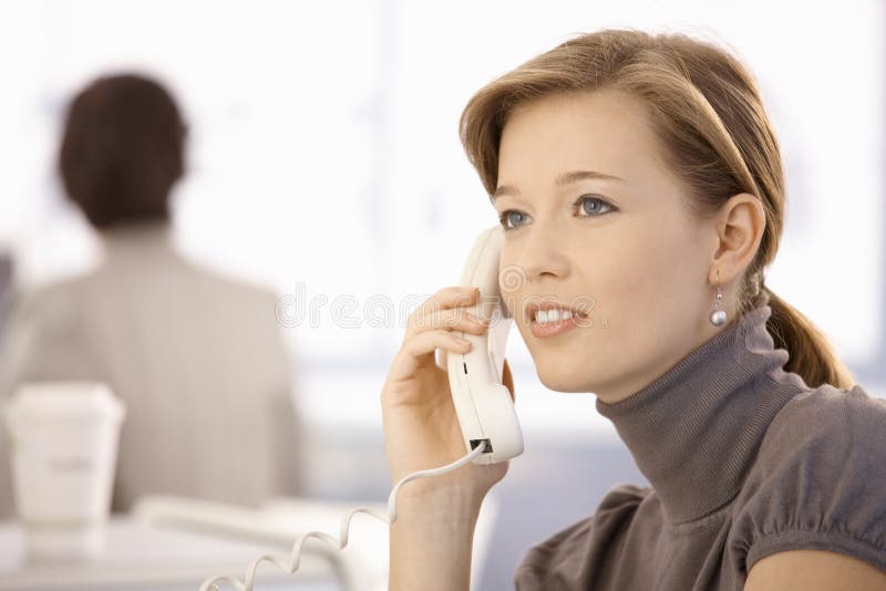 Young woman talking on phone