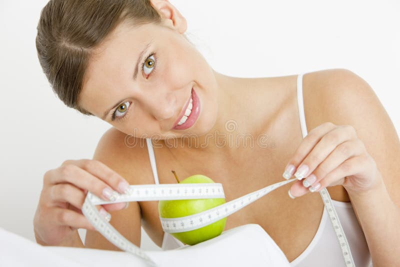 Young woman with tape measure