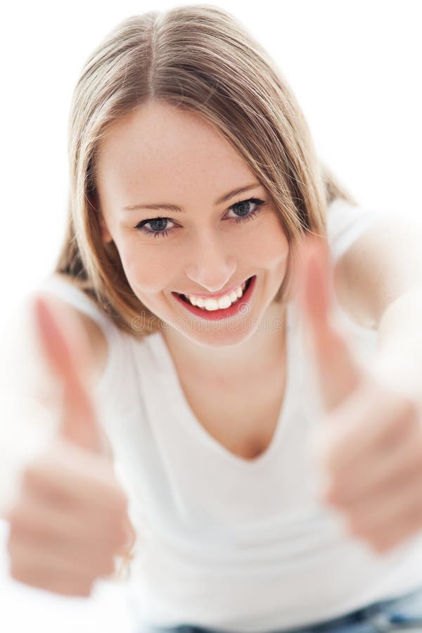 Young woman with thumbs up stock photo